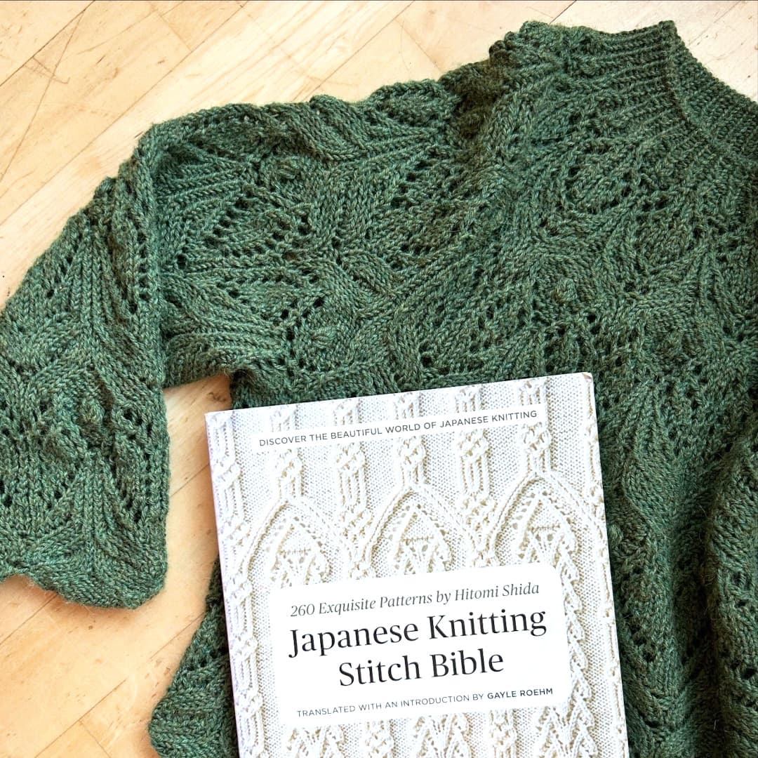 Knitted sweater and a pattern book