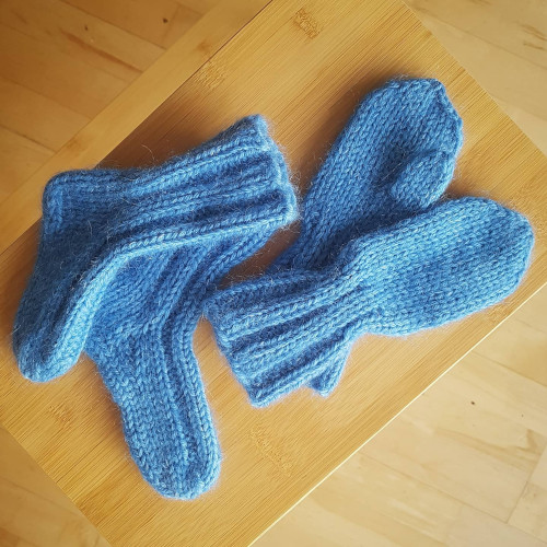 set of blue socks and mittens