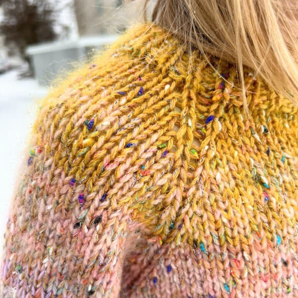 A shoulder of a leftover sweater